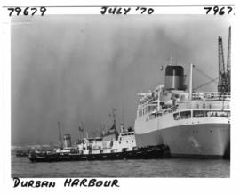 Durban, July 1970. Harbour tug 'Danie du Plessis' alongside the 'Windsor Castle' of the Union-Cas...