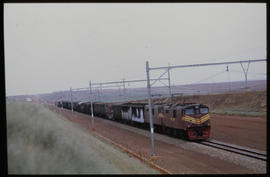 Bapsfontein, December 1982. Electric locomotive with goods train near Sentrarand. [T Robberts]