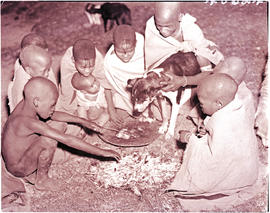 "Transkei, 1940. Children around fire."