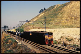 Johannesburg, 1989. Goods train passing mine dump.