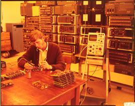 
Technician soldering circuit board.
