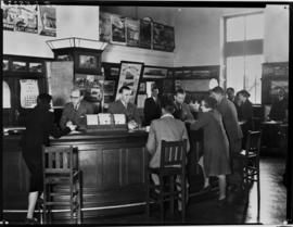 East London, September 1957. Interior of new tourist office and staff.