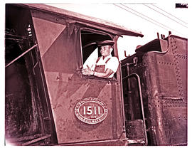 Springs, 1966. SAR. Driver in the cabin of SAR class 12R No 1511 at locomotive depot.