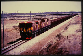 Kenhardt district. Four SAR Class 9E's with empty iron ore wagons on the Saldanha - Sishen line.