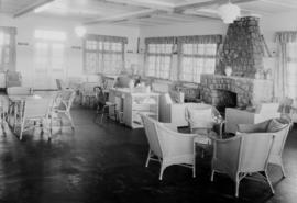 Richards Bay, 1935. Interior of lounge at holiday huts, showing fireplace.