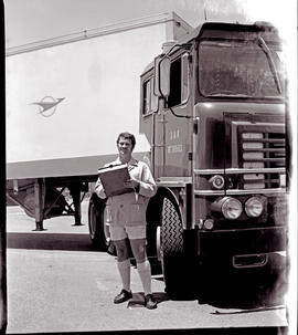 
Driver standing at SAR ERF refrigerator truck No MT80563. ERF = Edwin Richard Foden.
