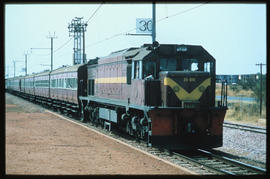 
SAR Class 34-000 No 34-614 with passenger train at railway station.
