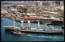 Durban. SAR tug guiding ship into Durban Harbour.