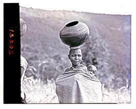 "Northern Transvaal, 1946. Bavenda woman with clay pot on head."