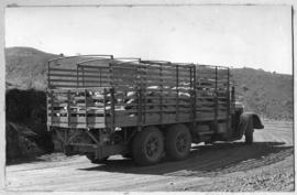 SAR Mack three-axle truck loaded with bags. See N43312.