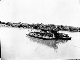 Upington, 1915. SAR goods wagon No 7402 crossing Orange River on pontoon.