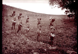 "Eshowe district, 1929. Five Zulu girls with water pots on heads."