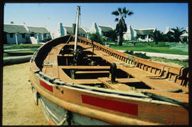Walvis Bay, 1990. Boat in complex of holiday cottages.