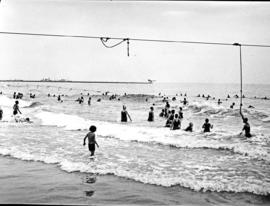 Port Elizabeth, 1930. Bathers in the water at Humewood beach.