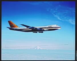SAA Boeing 747 Super B ZS-SAS 'Helderberg' in flight. With Mount Rainier, near Seattle, in the ba...