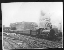 Johannesburg. Class 16C pulling a passenger train through station. Previously M1914. (Postcard do...