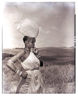 Natal South Coast, 1952. Zulu woman with bag on head.