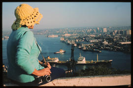 Durban, July 1973. Tourist overlooking Durban Harbour. [S Mathyssen]