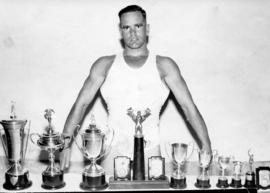 Sergeant Rudolf Kemp, Railway Police Germiston, with athletic trophies.