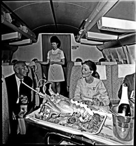 
SAA Boeing 707 interior. Cabin service. Hostess. Lobster.
