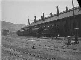 Cape Town. A pair of SAR Class 15A's parked against SAR Class 02 'Wynberg Tank' at Tennant shed. ...