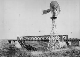 Taung, 1895. Bridge with wind turbine in the foreground. (EH Short)