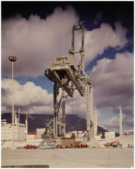Cape Town, July 1977. Container being loaded onto internal semi-trailer at BJ Schoeman dock in Ta...