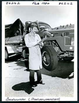 
Driver standing next to  SAR International Harvester truck.

