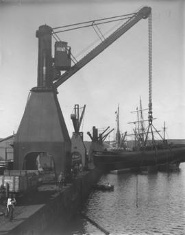 Durban. The 'Whelp' being lifted by crane in dock yard. Durban Harbour.