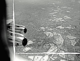 
SAA Boeing 707. Air to air. Shot of two engines through window.
