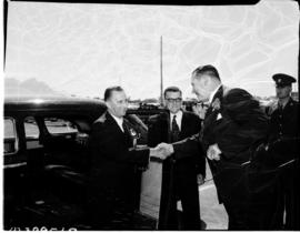 Cape Town, November 1955. Opening of DF Malan Airport. Men greeting next to car.