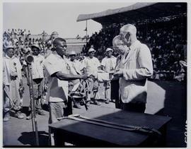 Johannesburg, 1951. Man receiving award at tribal dance.