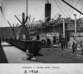 Durban, circa 1920. Coaling a ship at Durban Harbour.
