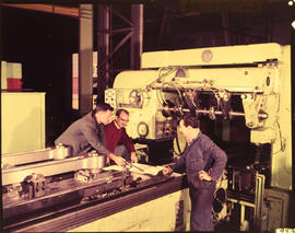 Pretoria, September 1968. Three men discussing drawing at large milling machine at Koedoespoort w...