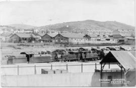 Pretoria. Railway cottages, with CSAR Class B and Class E converted locomotives in the foreground...