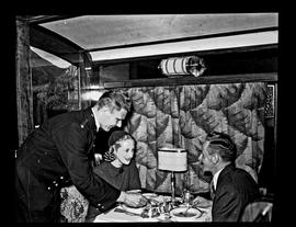 Couple being served in SAR A-28 dining car.