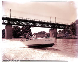 Vereeniging, 1954. Speedboating on the Vaal River under bridge.