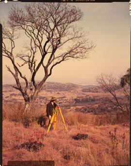 Land surveyor doing field work.