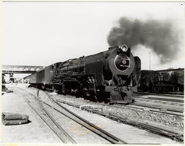Beaufort West, 1956. SAR Class 25 with passenger train.