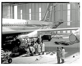
SAA Boeing 707 ZS-CKC engine being worked on in hangar. Note painted engines.
