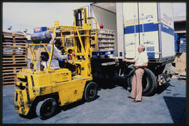 Johannesburg, 1986. Forklift lading pallet into container.