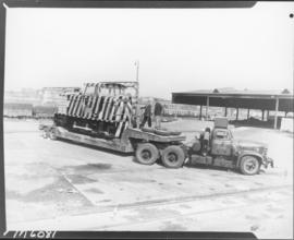 Germiston, 1961. Abnormal Load. SAR Diamond T truck No MT8216 hauling Hunslet-Taylor 480hp diesel...