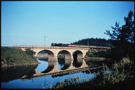 Natal South Coast. Train on bridge over river.