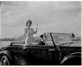 Cape Town, 21 April 1947. Princess Elizabeth standing up in the Royal Daimler to greet the crowd ...