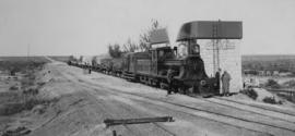 Potfontein, 1895. Cape 3rd Class Dubs locomotive at water tank.  (EH Short)