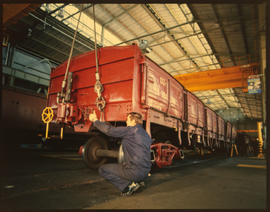 Johannesburg, November 1986. Checking bogies of SAR DZ-1 wagon at Sentrarand. [T Robberts]