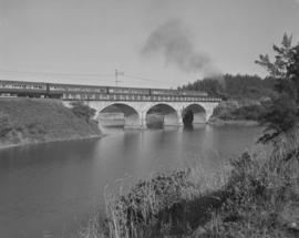 Amanzimtoti, 1968. Passenger train crossing bridge over river.