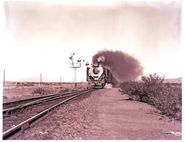 "Beaufort West district, 1962. SAR Class 25 with passenger train near Renosterkop siding, ap...