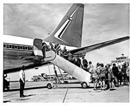 Johannesburg, 1970. Jan Smuts airport. SAA Boeing 707 ZS-SAE. Passengers boarding at rear of airc...