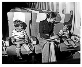 
SAA Boeing 747 interior. Mother and two young boys.

